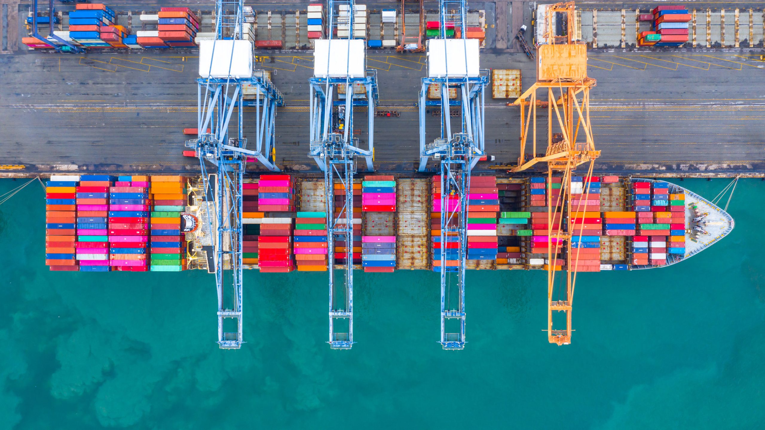 Container ship is loading in a port, Aerial top view container s