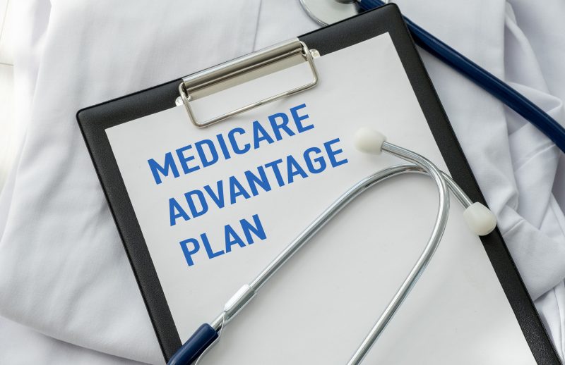 A clipboard with the word Medicare Advantage written on it