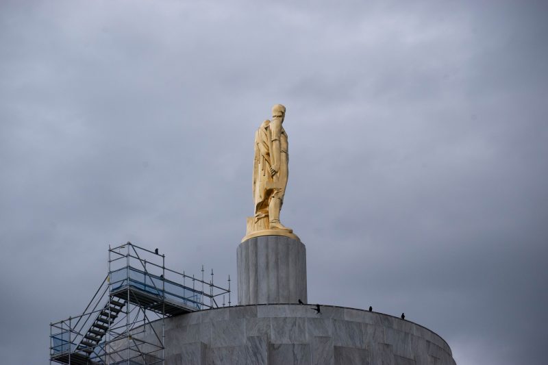 The Oregon Pioneer sculpture on top of the Oregon State Capitol Building in Salem, Oregon.