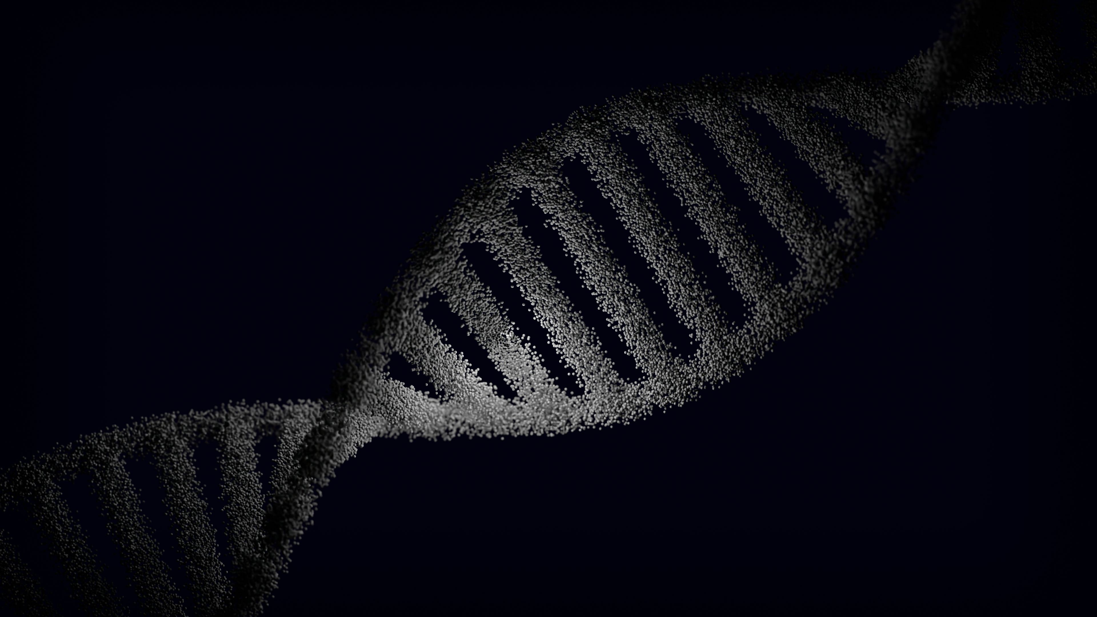 DNA Strand Artistic rendering of a DNA strand with particle effects against a dark background.