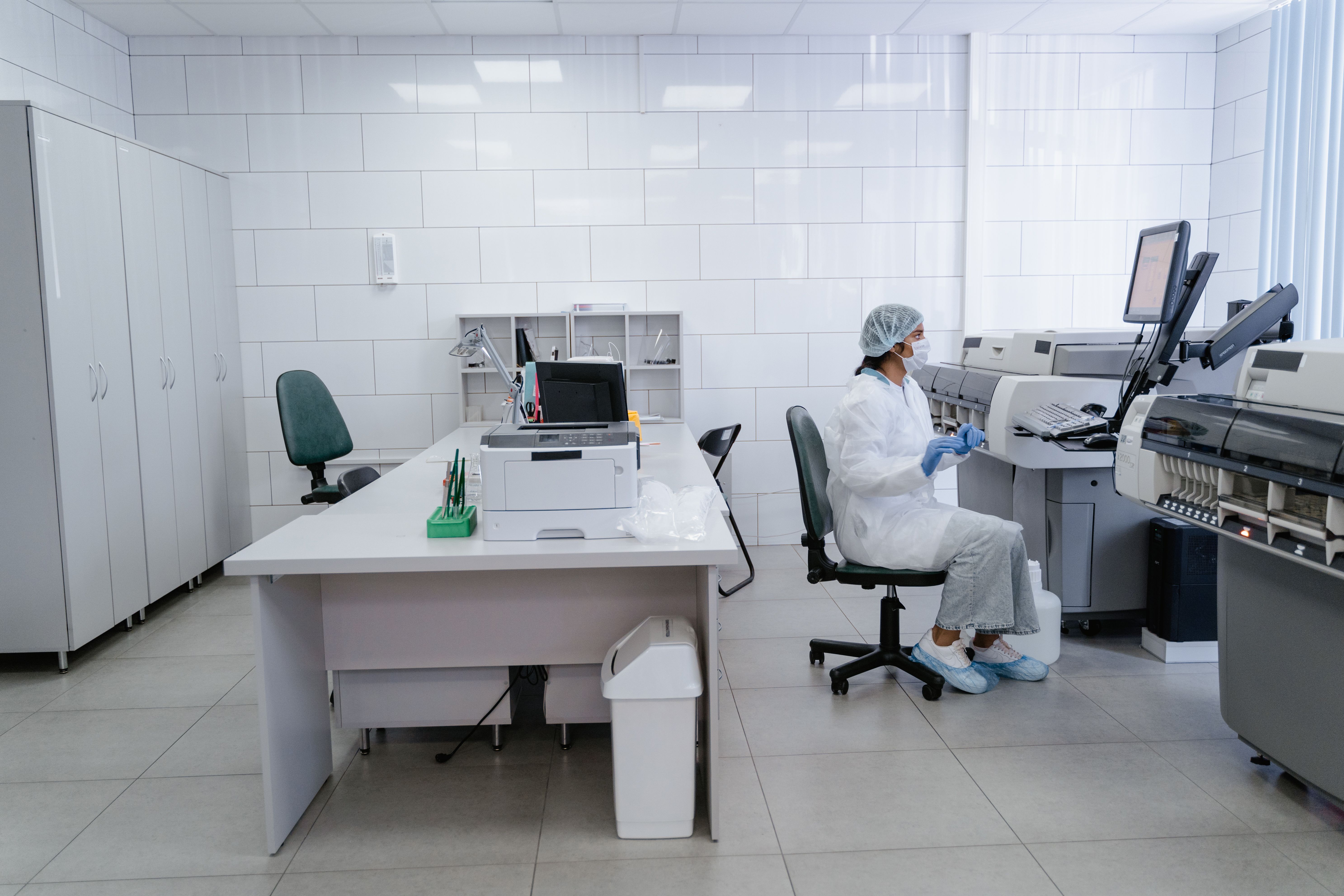 A female scientist works attentively in a well-equipped laboratory setting. A female scientist works attentively in a well-equipped laboratory setting.