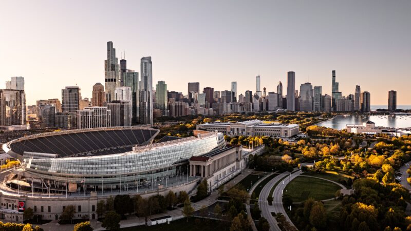 Stunning aerial view of Chicago's skyline and Soldier Field during sunset.